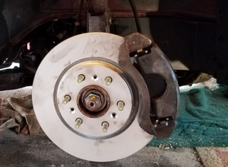 Illustration for article titled What it takes to change a set of pads and rotors